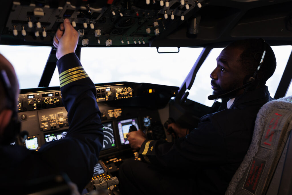 pilot license training - pilots in the flight deck of a simulator 